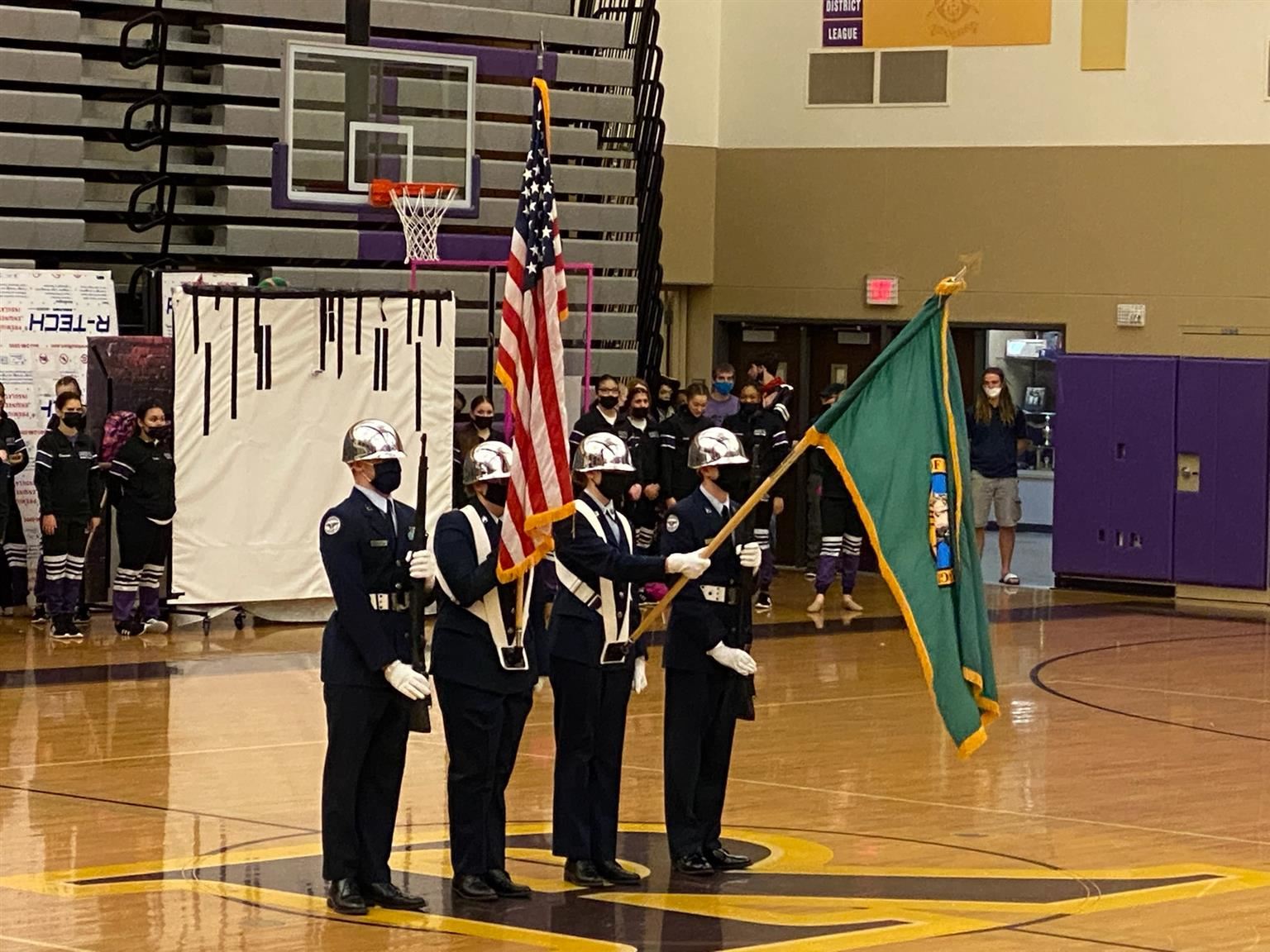 Color guard team performs at Rogers for 8th grade orientation